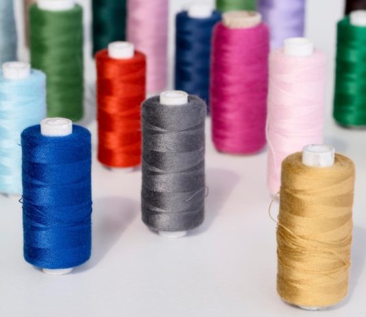 Salt, sweat, and sea. Corrosion and wicking tests for marine and beach footwear sewing machine thread